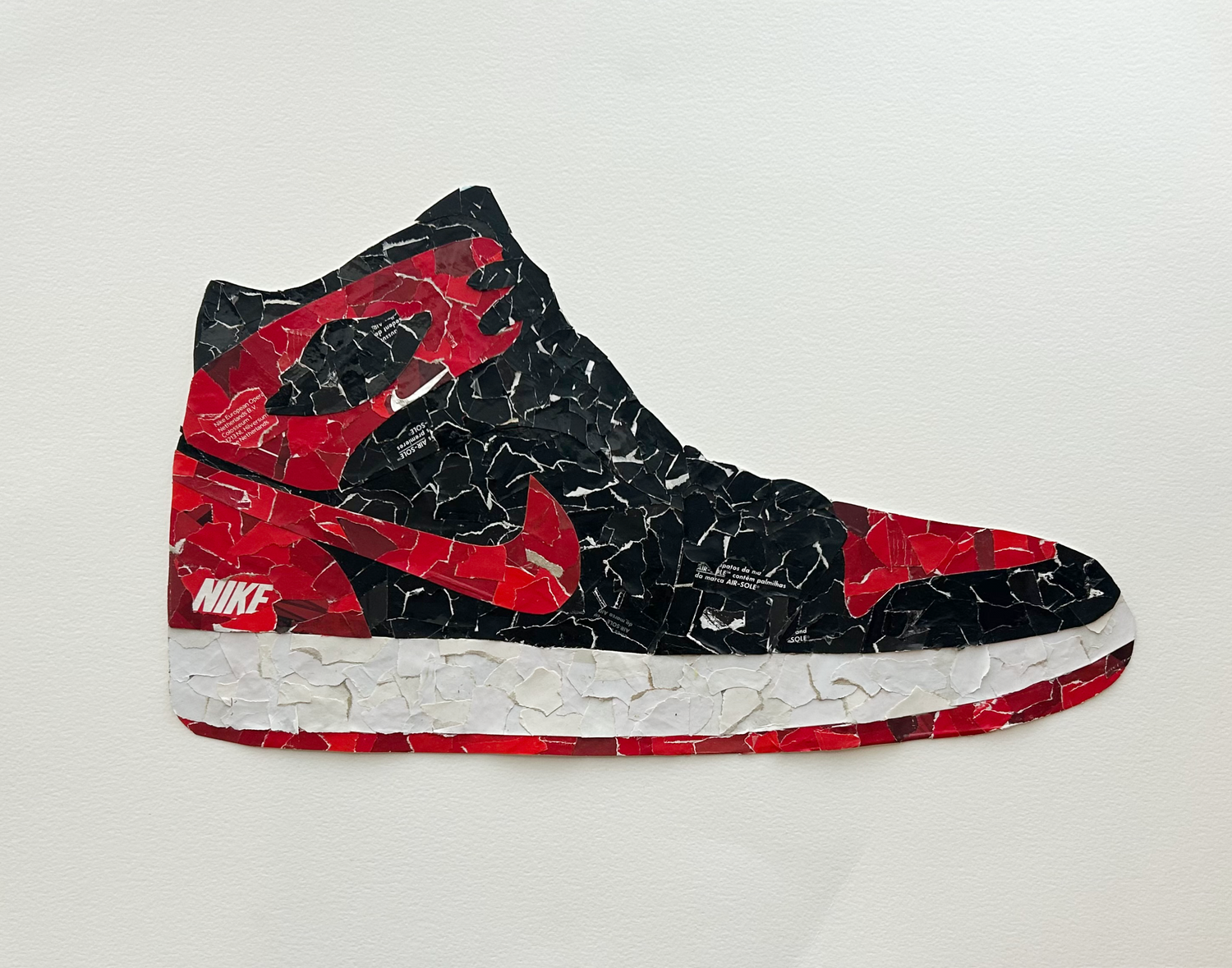 One-of-one textured artwork by Rare23 featuring deconstructed sneaker box materials inspired by Bred 1s reconstruction